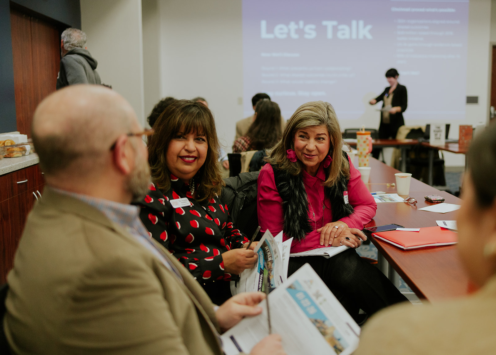 Two participants smiling during a community session